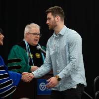 Student shaking hands after name is read
